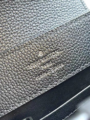 CAPUCINES EAST-WEST MINI 21 IN BLACK TAURILLON